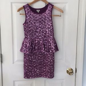 A sparkly purple dress with plain back!